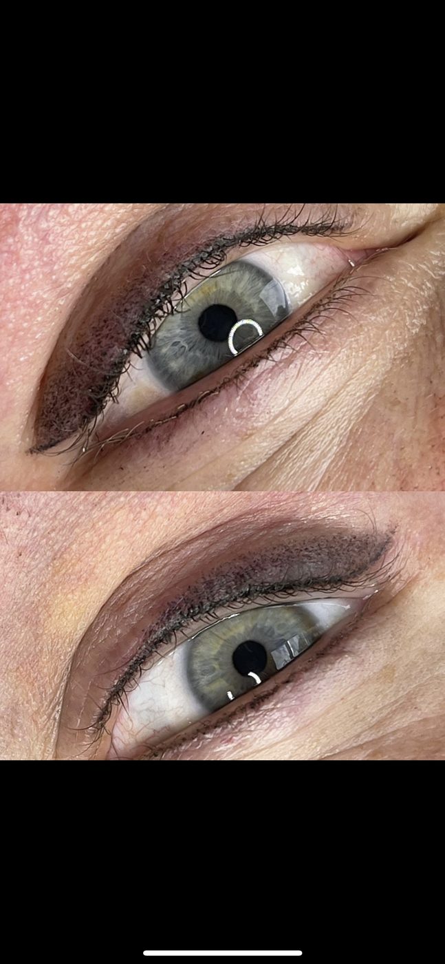 A close up of a woman 's eye with makeup on it.