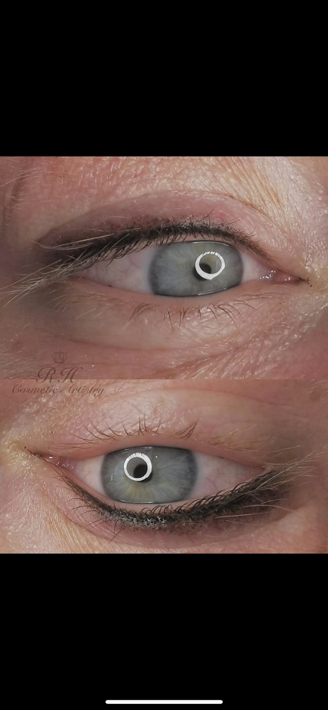 A close up of a woman 's eye with makeup on it.