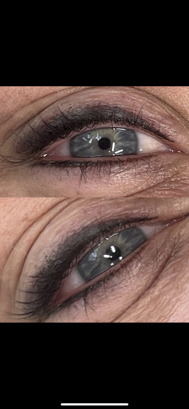 A close up of a woman 's eyes with makeup on.